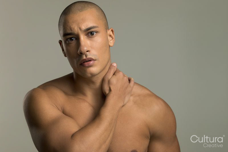Studio portrait of serious shirtless man