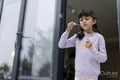 Little girls blowing soap bubbles outdoors