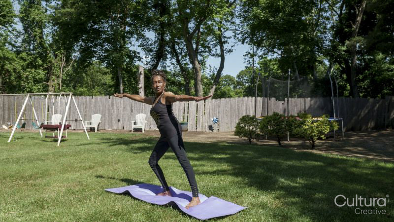 Senior woman doing yoga outdoors