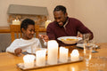 Father and son eating dinner together at home