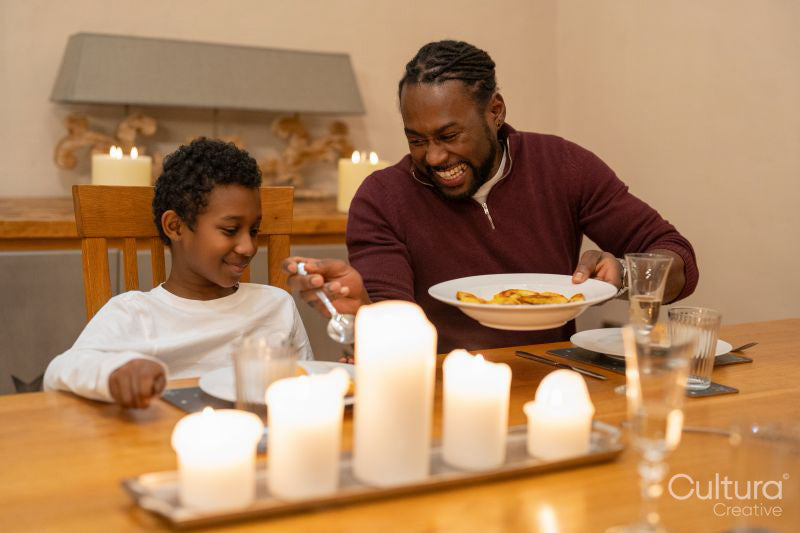 Father and son eating dinner together at home