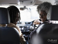 Mother and son sitting in car