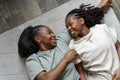 Directly above view of couple lying down on carpet