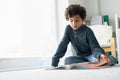Boy reading book at home