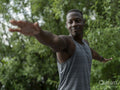 Man practicing yoga in park