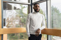 Portrait of young businessman standing in office