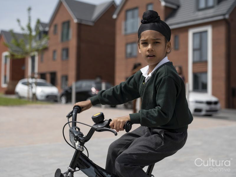 Portrait of boy riding bicycle