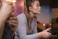 Friends playing in video games at pub