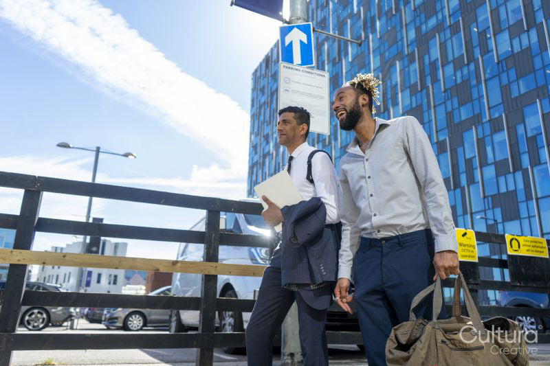 Two businessmen walking in business district