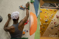 Rear view of woman on climbing wall