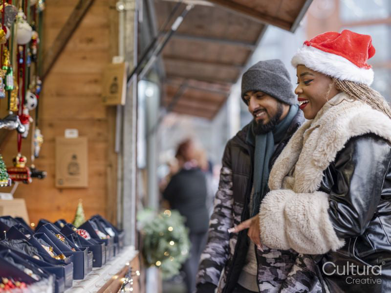 Young couple shopping for Christmas decorations