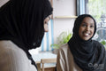 Young female friends meeting in cafe