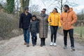 Three generation family walking together in rural area