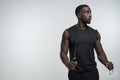 Portrait of man holding jump rope