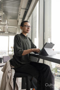 Woman using digital tablet in office