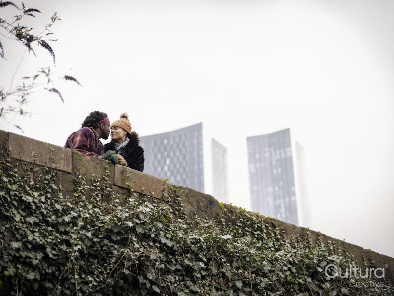 Couple kissing on bridge