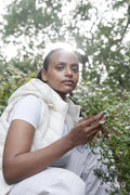 Portrait of woman at blooming bush