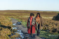 Two senior women hiking in moorland