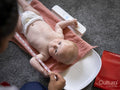 Nurse taking growth measurements of baby girl
