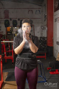 Portrait of woman with powder on hands in gym