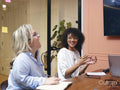 Smiling women having meeting in office