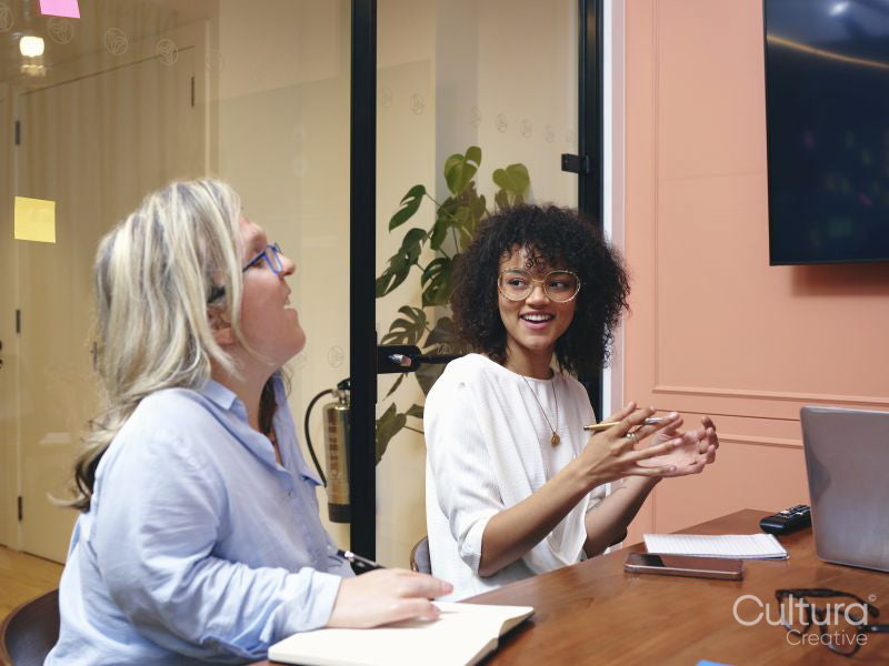 Smiling women having meeting in office