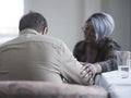 Therapist consoling patient in therapy session