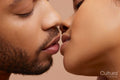 Studio portrait of kissing couple