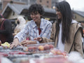 Female couple shopping in farmer''s market