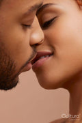 Studio portrait of kissing couple