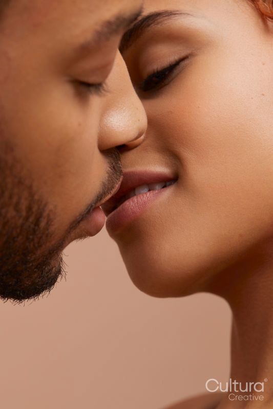 Studio portrait of kissing couple