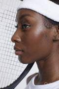 Close-up of woman with tennis racket