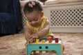 Baby girl playing at home