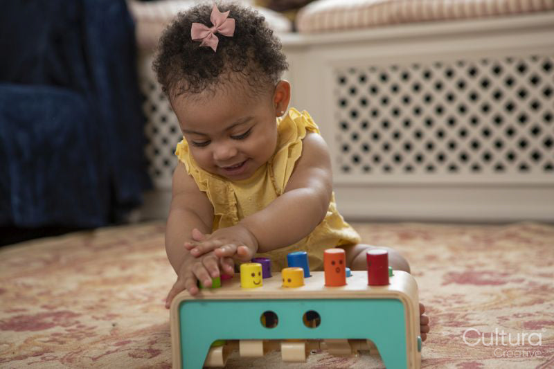 Baby girl playing at home