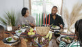 Family with children eating Kwanzaa meal