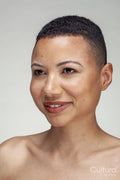 Studio portrait of smiling woman
