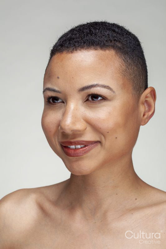 Studio portrait of smiling woman