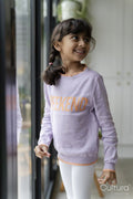 Little girl standing near window