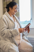 Senior lady sitting with photography at nursing home