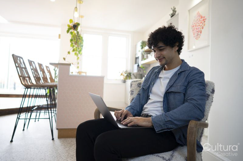 Businessman using laptop in office