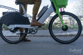 Man riding rental bicycle