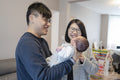 Smiling parents looking at baby girl