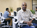 Portrait of man in co-working office space