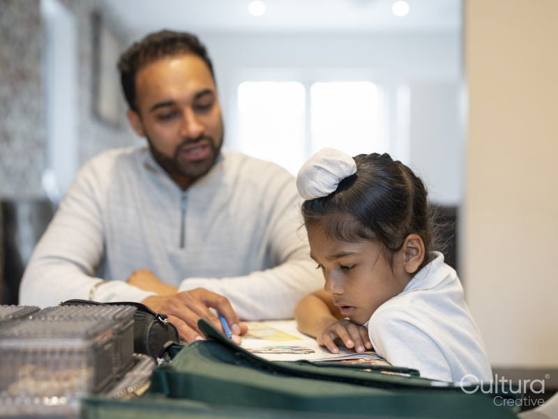 Father helping son with homework