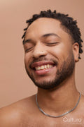 Studio portrait shot of happy handsome man
