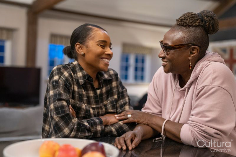 Two women talking at home