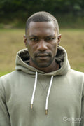 Portrait of man standing in park in autumn