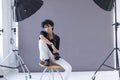 Portrait of female photographer at photo shoot