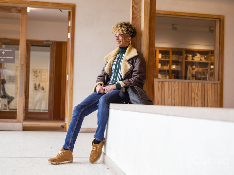 Young man sitting in lobby