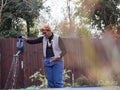 Woman watering plants in backyard